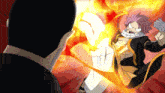 a man in a black shirt is standing next to a cartoon character with a fire coming out of his hand