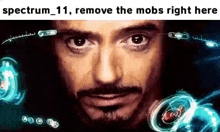 a close up of a man 's face with the words `` spectrum 11 , remove the mobs right here ''