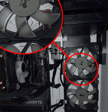 a gigabyte power supply is next to a few fans