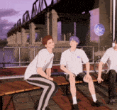 a group of young men are sitting on a bench with one wearing a shirt that says bb