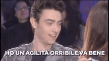 a man and a woman are looking at each other with the words ho un ' agility orribile va bene below them