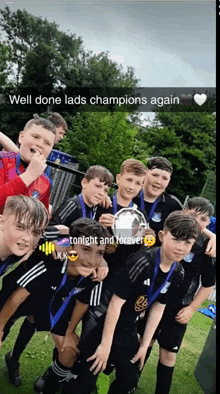 a group of young boys posing for a picture with a caption that says " well done lads champions again "
