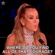 a woman speaking into a microphone with where do you find all of that courage written below her