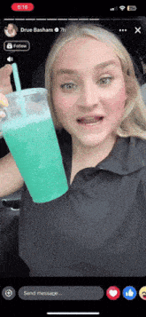 a woman is holding a blue drink in front of a phone screen that says drue basham