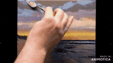 a person is painting a sunset on a canvas with the words made in animotica on the bottom right
