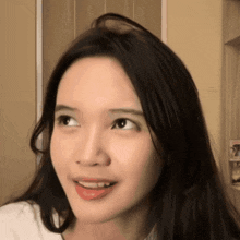 a close up of a woman 's face with her tongue hanging out