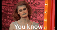 a picture of a drag queen with the words " you know " on the bottom