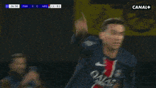 a soccer player is giving a thumbs up during a game on canal +