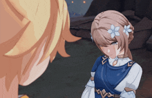 a girl with flowers in her hair is standing next to a man