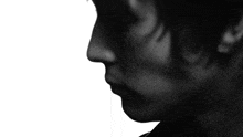a close up of a man 's face with a hat on