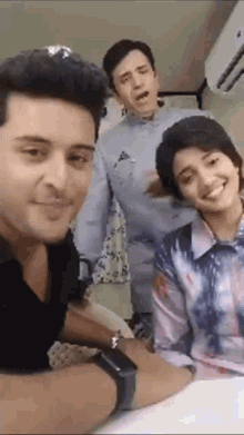 a man and a woman are posing for a picture together