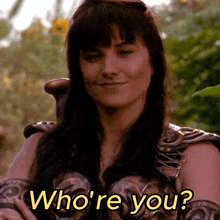 a woman is smiling with the words who 're you on the bottom