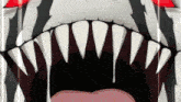 a close up of a person 's mouth with sharp teeth coming out of it