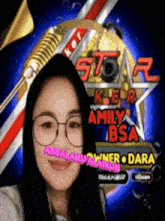 a woman wearing glasses is standing in front of a sign that says " amily bsa "