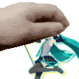 a pixel art of a hand holding a picture of a girl .