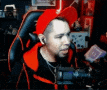 a man in a red hat is sitting in a chair