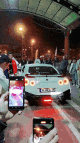 a white sports car with license plate 34 mek 95