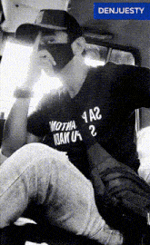 a man wearing a mask and a shirt that says wotha 1 a2