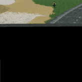 a person riding a bike down a road near a beach