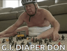 a man in a diaper is playing with toy soldiers
