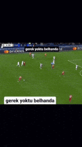 a soccer field with playstation advertisements on the side