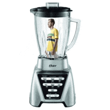 an oster blender with a man in a yellow shirt inside of it