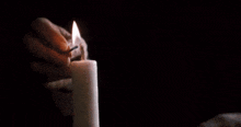 the dead poets society logo with a lit candle in the foreground