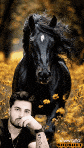 a man with a tattoo on his arm stands next to a horse