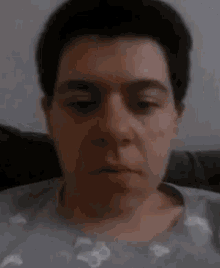 a close up of a person 's face with their eyes closed