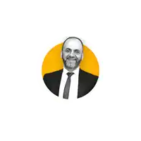 a man in a suit and tie is standing in a yellow circle