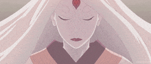a close up of a woman 's face with her eyes closed and a red circle on her forehead ..