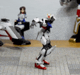 a toy robot is standing on a piece of paper that says ' cc ' on it