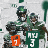 a group of jets football players standing next to a nyj 3 sign