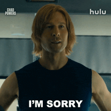 a man says i 'm sorry in front of a sign that says hulu