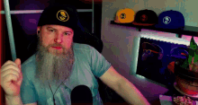 a man with a beard wearing a hat that says sd