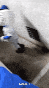 a blurry picture of a person playing a game with the words game 1 on the bottom