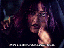 a blurred image of a person with the words she 's beautiful and she glows great