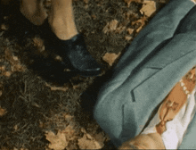 a person laying on the ground with their pants down