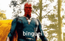 a blurry picture of a man in a superhero costume with the word binguei above him
