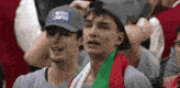 two men wearing hats that say national champions