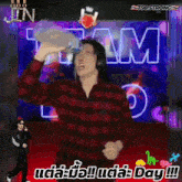 a man wearing headphones is dancing in front of a sign that says t88strong