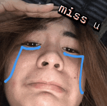 a close up of a person 's face with miss u written on the top