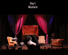a man is dancing on a stage with the words day 1 mustard below him