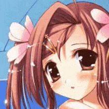 a girl with a flower in her hair is looking at the camera