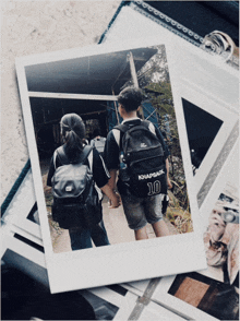 a man wearing a backpack with the number 10 on the back