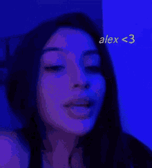 a close up of a woman 's face with alex < 3 written on the bottom right