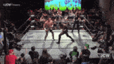 two wrestlers in a wrestling ring with jcw written on the bottom right