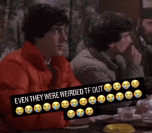 two men are sitting at a table with a sign that says " even they were weirded tf out "