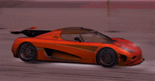a red sports car with the word one on it