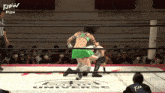 two women are wrestling in a ring that says universe on the floor